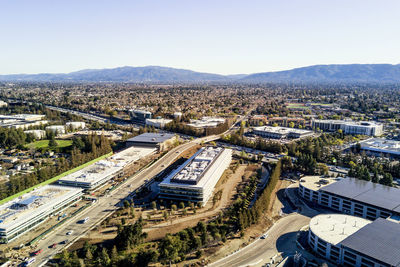 High angle view of city buildings against clear sky