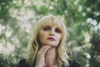 Portrait of woman standing outdoors