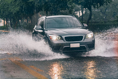Water splashing on street in city