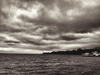 Scenic view of sea against cloudy sky