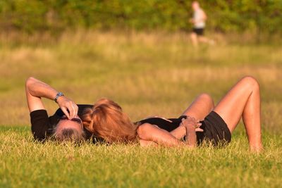 Woman relaxing on field