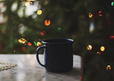 Close-up of coffee cup on table