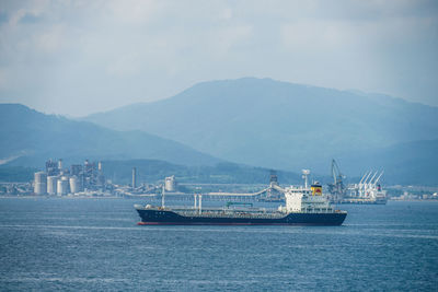 Boats in sea against sky