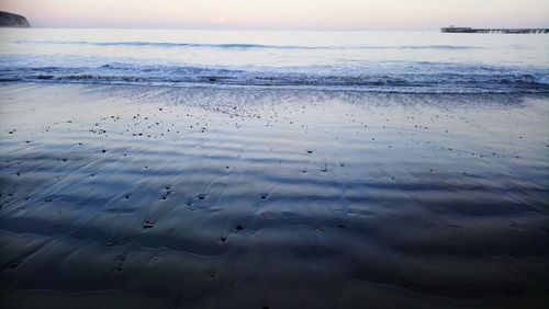 Scenic view of sea against sky at sunset