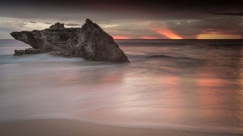 Scenic view of sea against sky at sunset