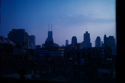 View of buildings in city at dusk