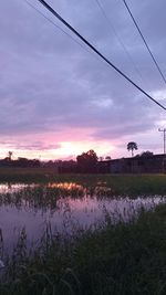 Scenic view of field against sky during sunset