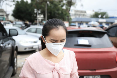 Portrait of young woman in car