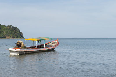 Boat in sea against sky