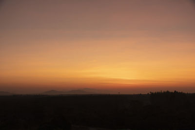 Scenic view of silhouette landscape against sky during sunset