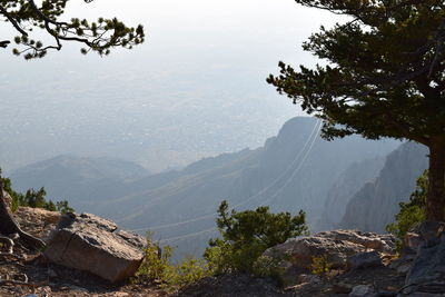 High angle view of trees and mountains against sky