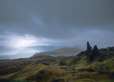 Scenic view of landscape and sea against sky