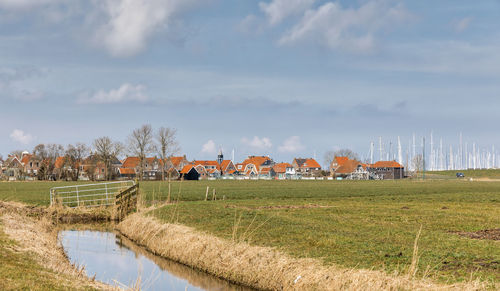 Scenic view of agricultural field against sky