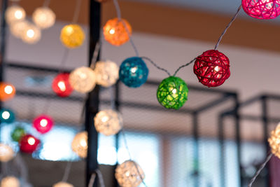 Illuminated lighting equipment hanging against ceiling