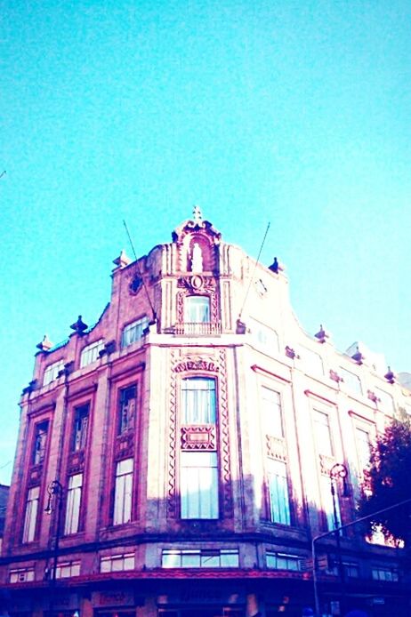 architecture, built structure, building exterior, low angle view, clear sky, blue, church, copy space, place of worship, city, religion, famous place, travel destinations, facade, spirituality, window, outdoors, history, travel