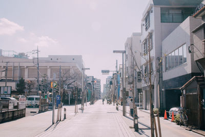 Road along buildings in city