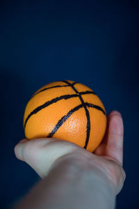 Close-up of hand holding ball