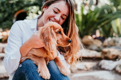 Woman with dog at park