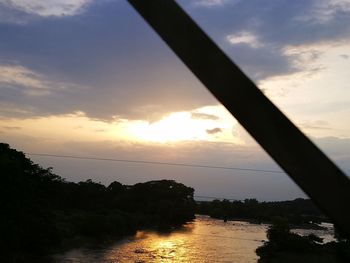 View of calm lake at sunset