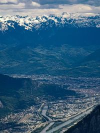 High angle view of snowcapped mountains against sky