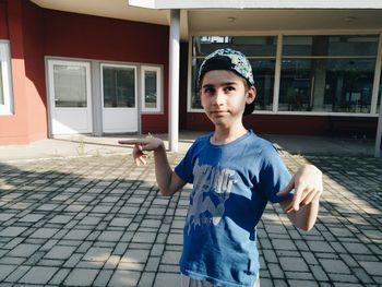 Portrait of boy standing outdoors