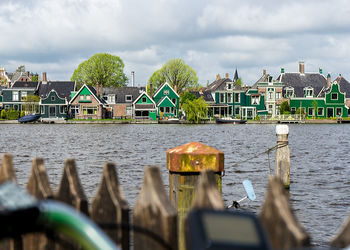 Panoramic view of bridge over river against buildings