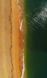 Aerial view of sunny golden beach with turquoise water top view