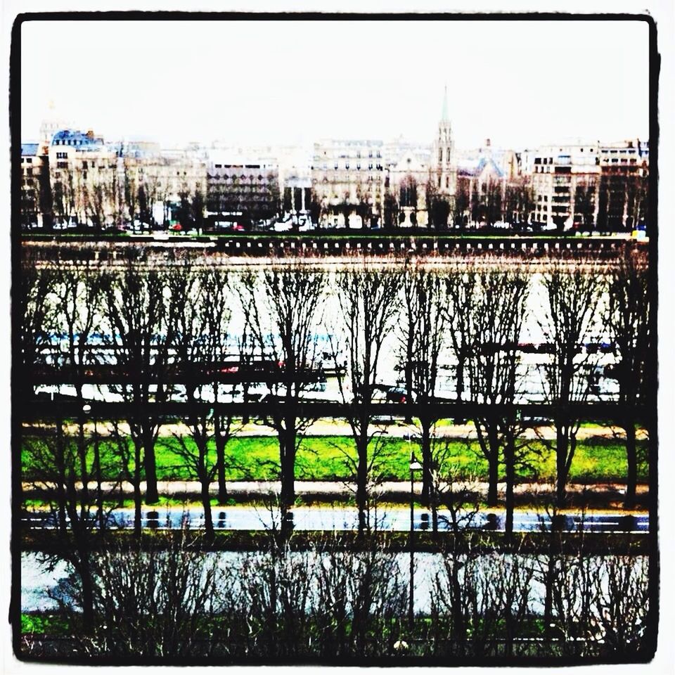 transfer print, architecture, built structure, clear sky, building exterior, auto post production filter, tree, water, city, river, grass, bridge - man made structure, sky, connection, growth, day, outdoors, copy space, no people, nature