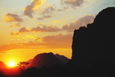 Silhouette mountains against sky during sunset