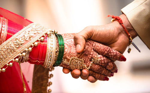 Close-up of hand holding umbrella