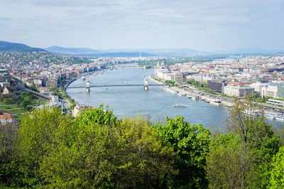 High angle view of river and buildings in city