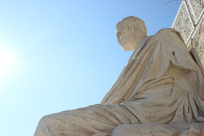 Low angle view of statue against clear blue sky