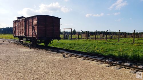 Train on railroad track against sky