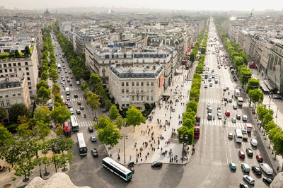 View of two tree-lined avenues leading to the arc de triomphe and all the urban traffic