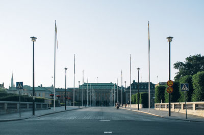 Illuminated street light against clear sky