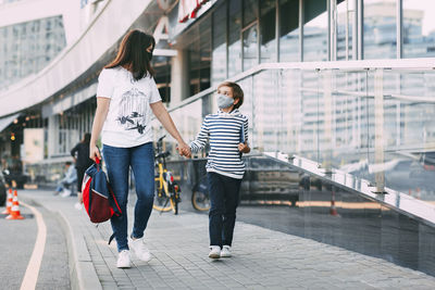 Close-up of mother and son on street