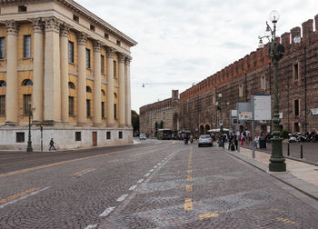 People walking on road in city