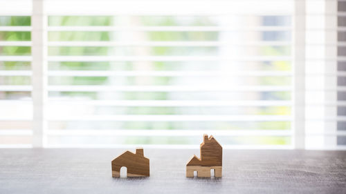 Close-up of toy on table against window