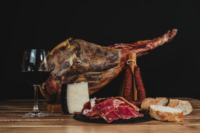 Close-up of food on table against black background