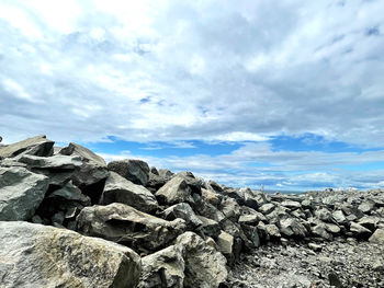 Rocks on land against sky