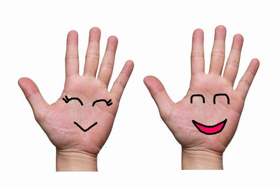 Low angle view of human hand against white background