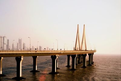 Pier over sea against clear sky