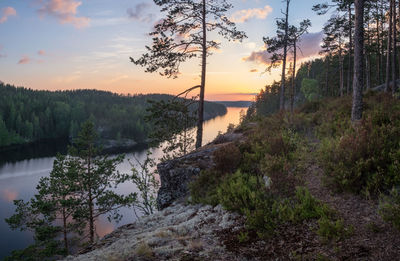 Scenic view of river against sky during sunset