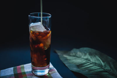 Close-up of beer glass on table