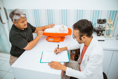 Doctor examining patient at clinic
