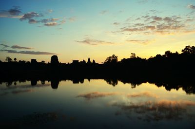 Scenic view of lake at sunset