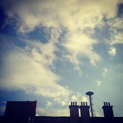 Low angle view of building against cloudy sky