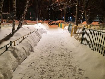 Snow covered street at night