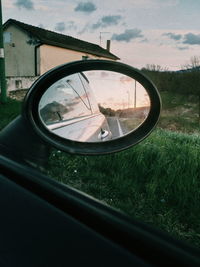 Reflection of car on side-view mirror