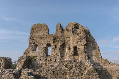 Low angle view of built structure against blue sky